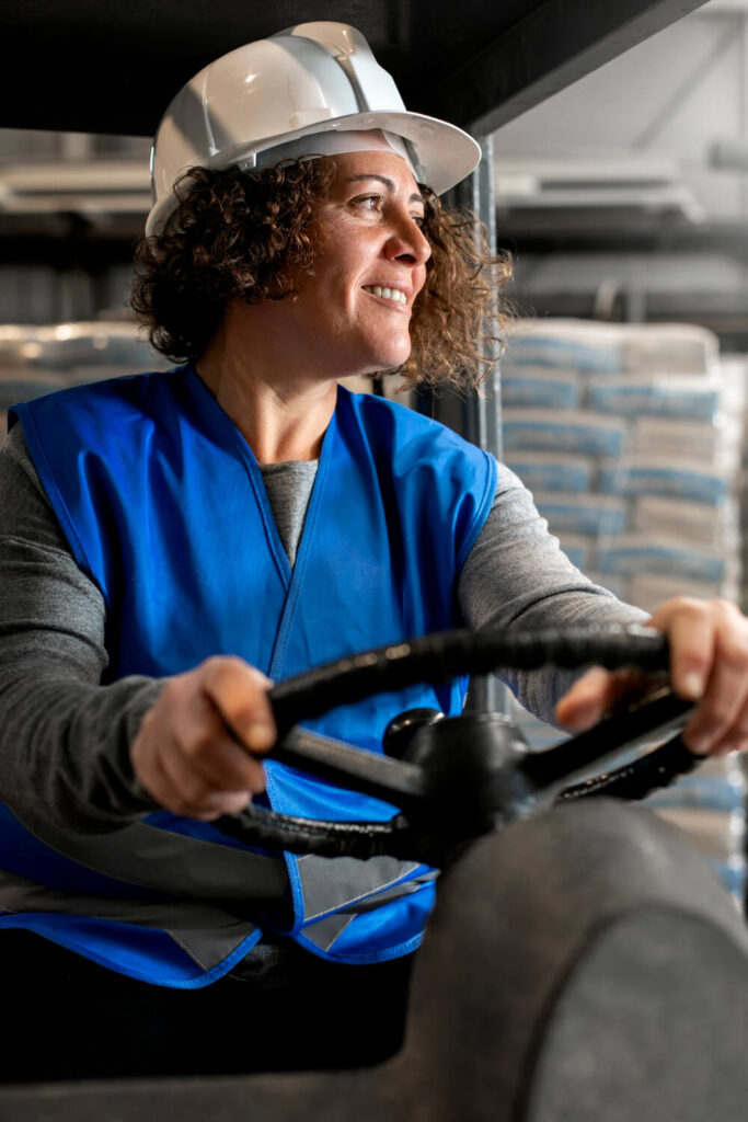 Professional Female Driver Operating Forklift