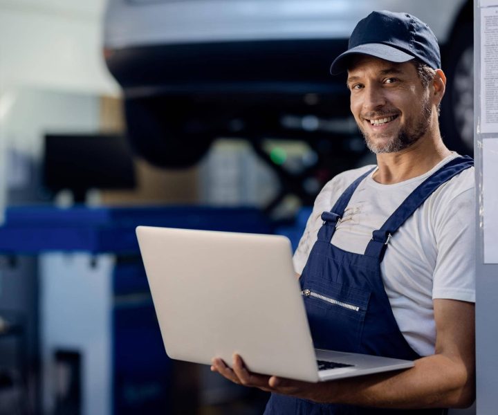 Happy Blue Collar Worker With An Effective Website